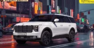 Un SUV blanco Hyundai Palisade en una calle urbana iluminada.